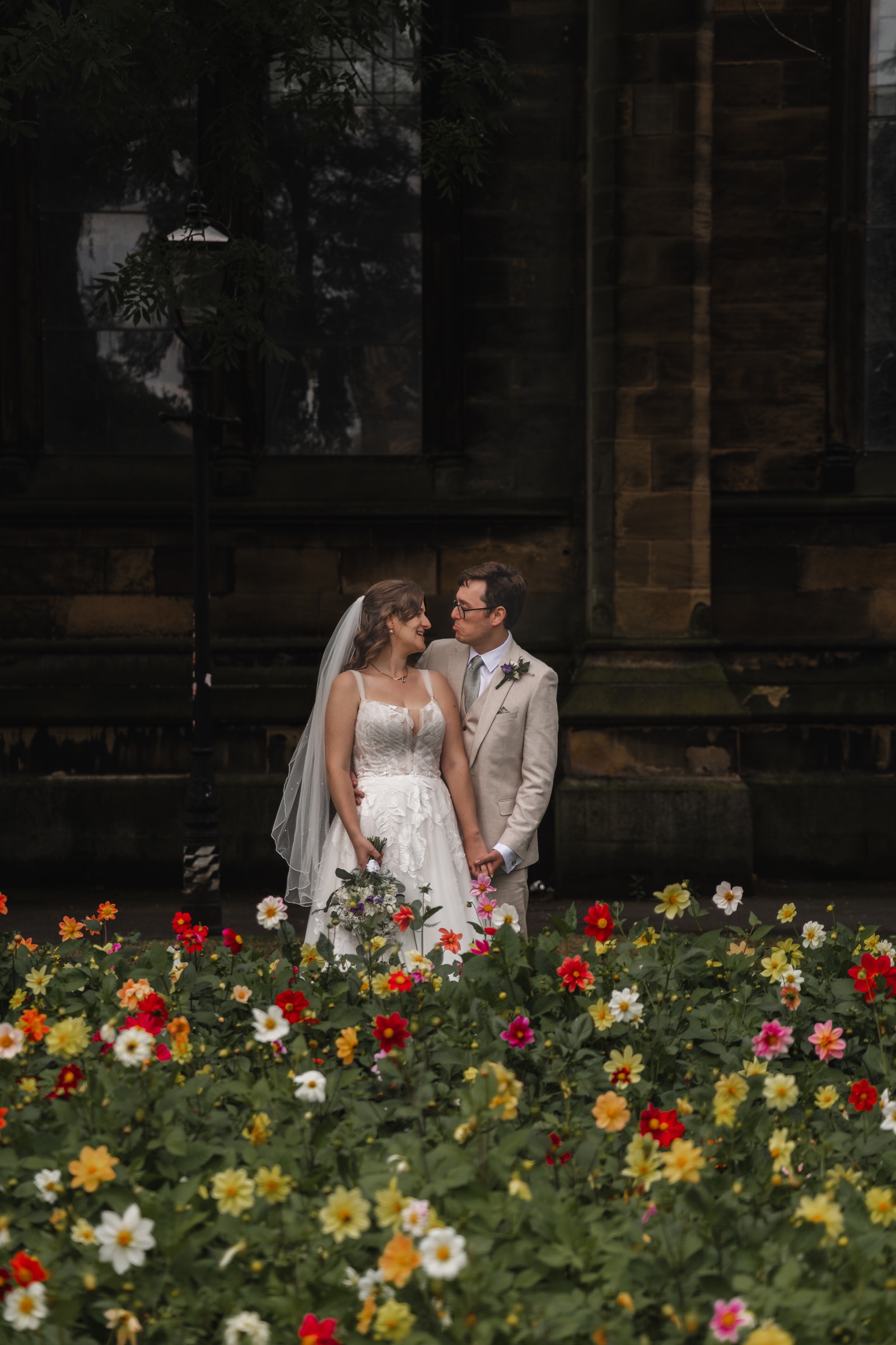 Ben and Tiffany framed in a shadowy city-centre doorway