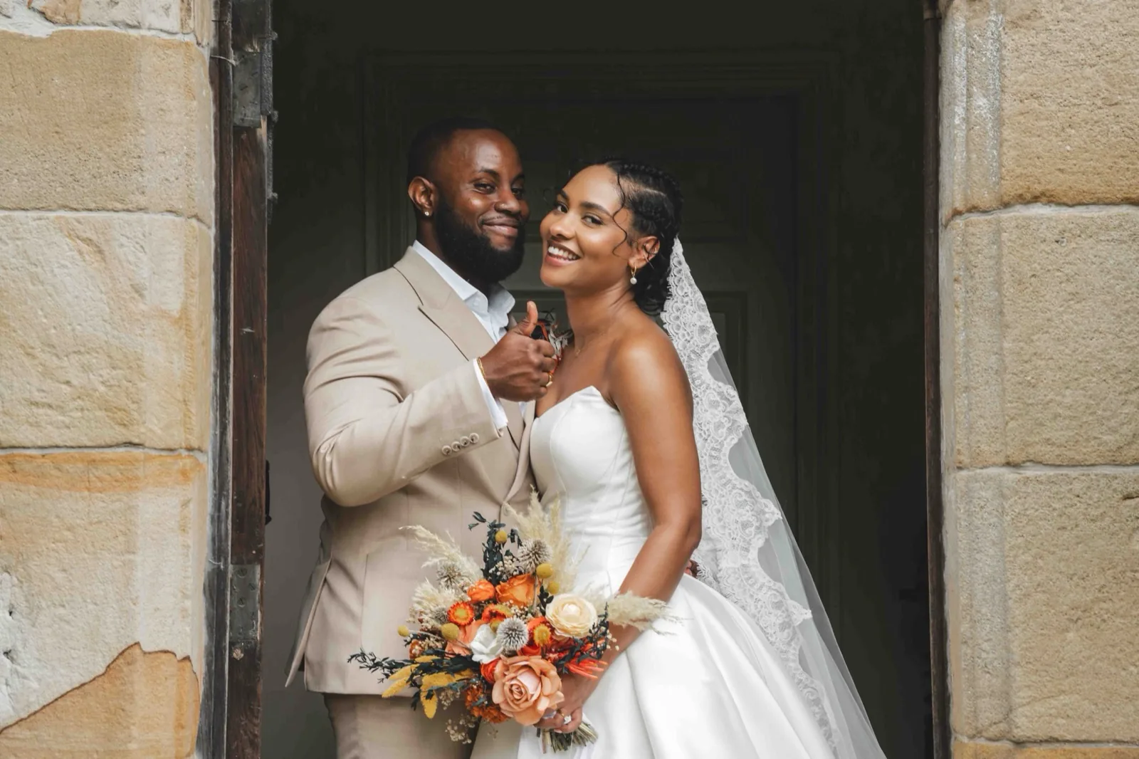 Jas and Greg celebrating at their Newcastle wedding
