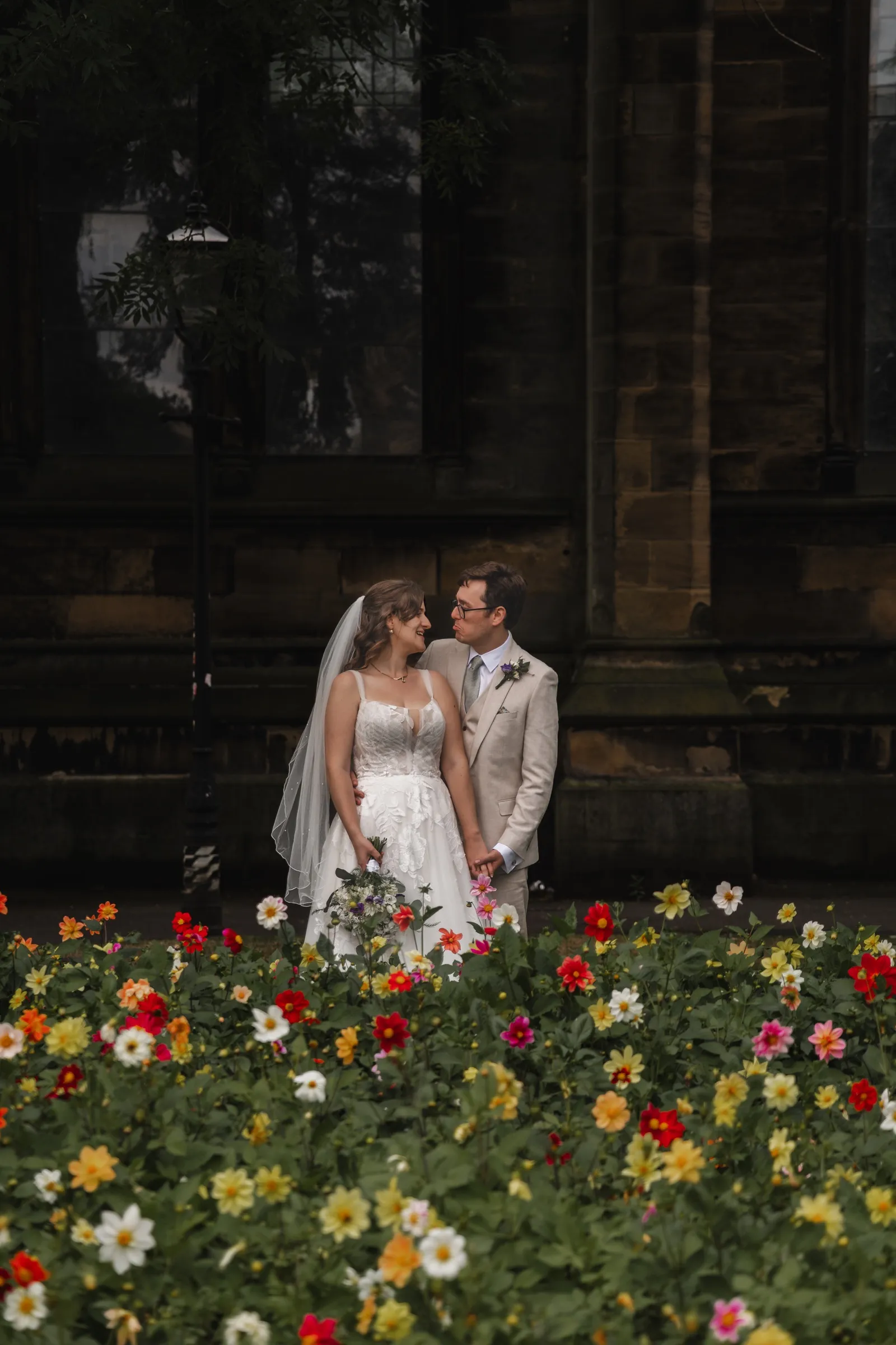 Ben and Tiffany framed in a shadowy city-centre doorway